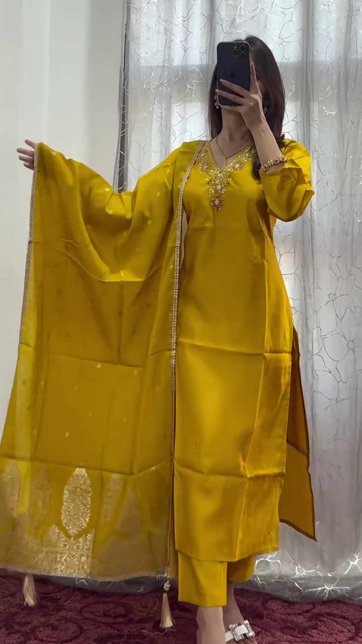Radiant Golden Elegance: A Majestic Traditional Yellow Ensemble with Intricate Embellishments and Flowing Grace