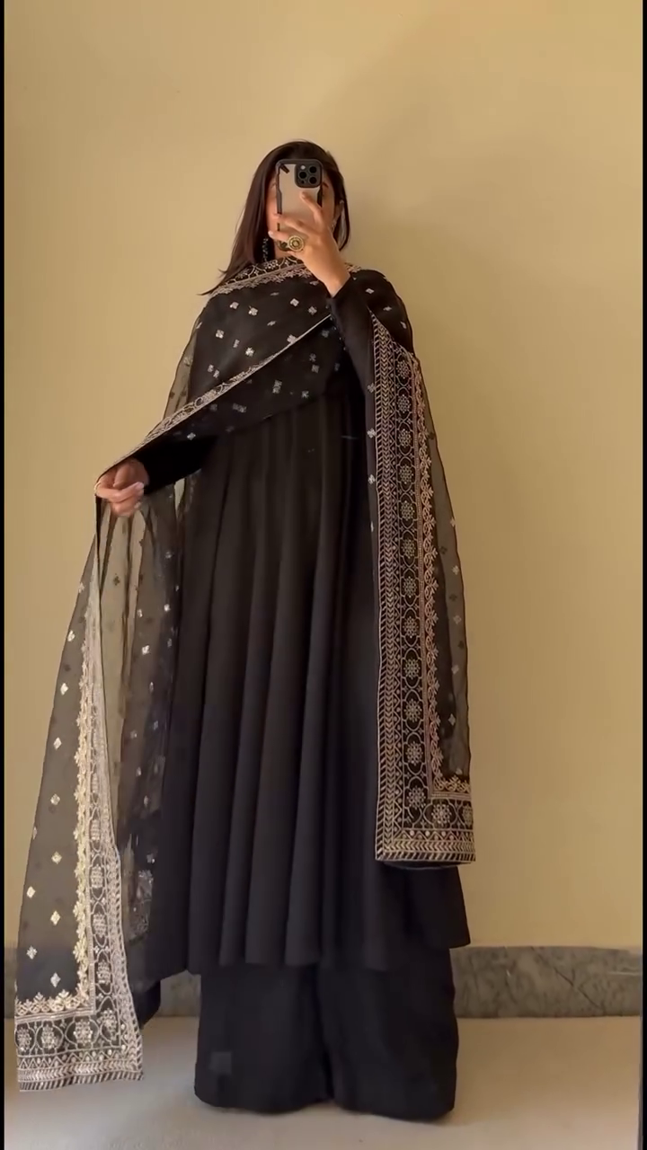 Timeless Grace: A Classic Black Ensemble with Exquisite Gold Embroidery and Sheer Detailing