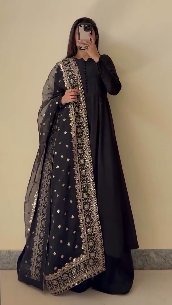 Timeless Grace: A Classic Black Ensemble with Exquisite Gold Embroidery and Sheer Detailing