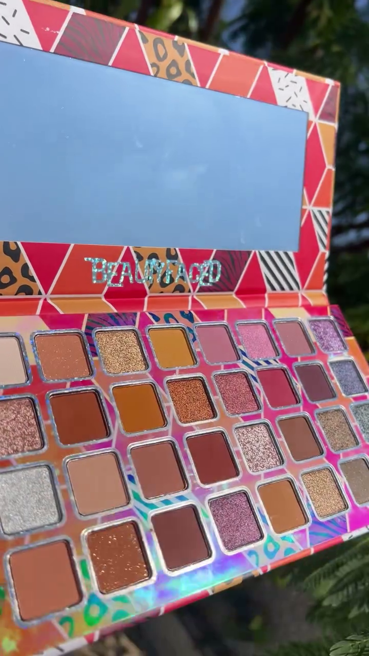 Vibrant Eyeshadow Palette with a Mix of Rich Matte and Shimmery Shades in Warm and Bold Tones, Perfect for Creating Stunning and Versatile Eye Looks
