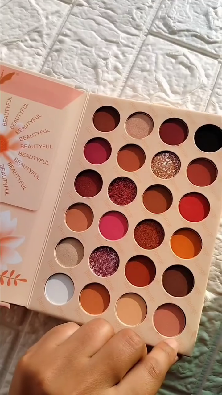 24-Color Matte and Shimmer Eyeshadow Palette with Bold Reds, Pinks, Oranges, and Neutrals for Vibrant and Glamorous Eye Looks