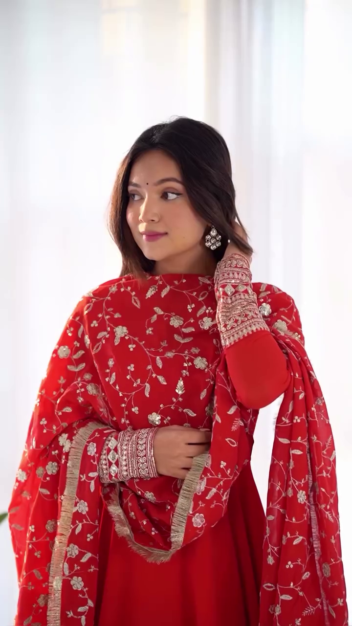 Elegant Red Anarkali Dress with Intricate Embellished Sleeves, Flowing Skirt, and Detailed Floral Dupatta for a Traditional yet Modern Look