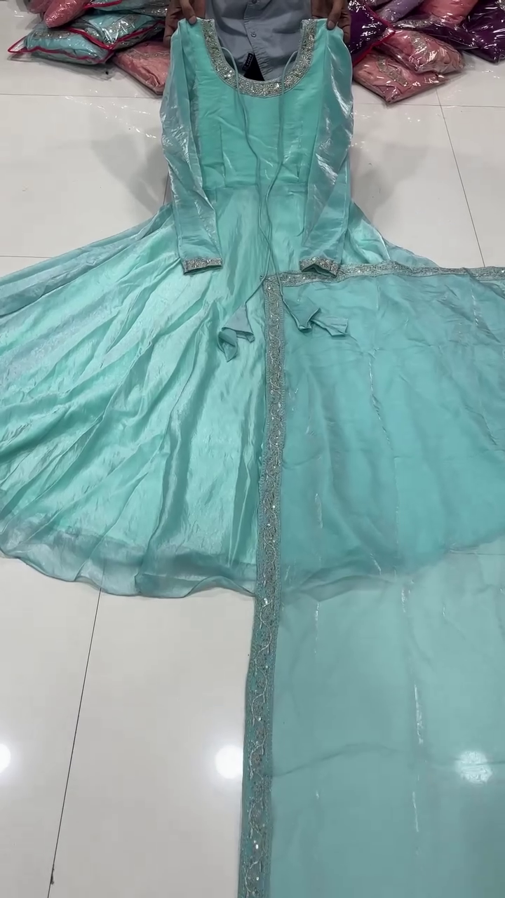 Aqua Blue Anarkali Dress with Intricate Embroidered Detailing and Flowing Skirt for Festive and Traditional Occasions