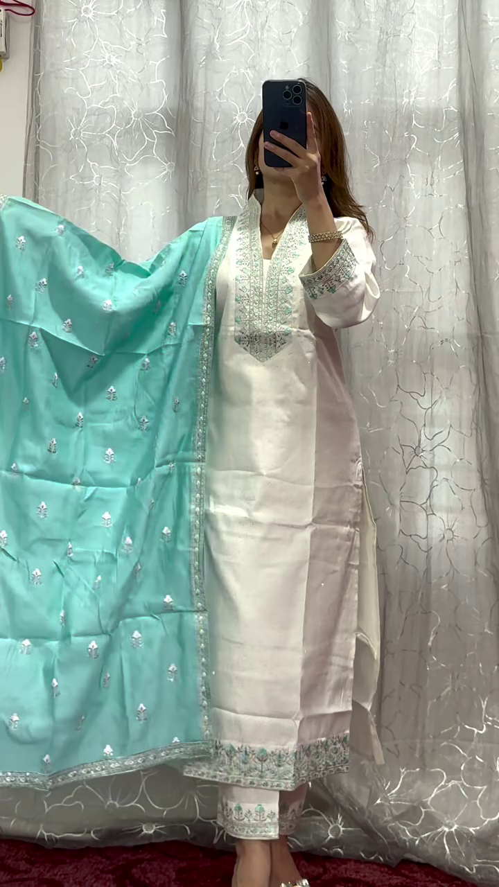 White and Aqua Blue Embroidered Lawn Kameez with Intricate Floral and Geometric Designs, Complemented with a Matching Embroidered Dupatta and Tapered Trouser