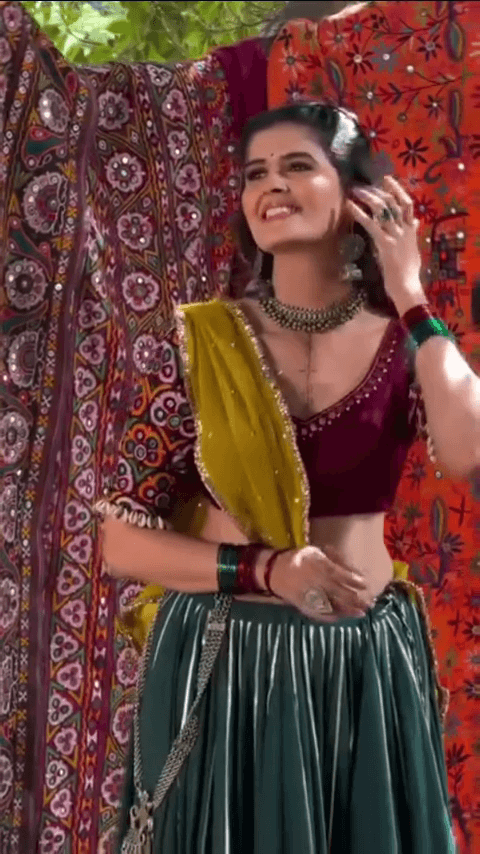 Vibrant Traditional Mirror Work Lehenga Set Featuring Deep Maroon Embroidered Choli, Bottle Green Flared Skirt with Tassels, and Contrasting Yellow Dupatta – Ideal for Navratri & Cultural Festivities