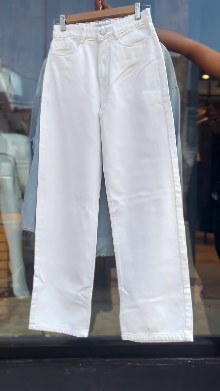 Trendy Two-Piece Set Featuring a Light Wash Denim Shirt Embellished with Colorful Butterfly Embroidery and Contrasting Multicolor Buttons, Paired with Classic High-Waist Straight-Cut White Jeans – Perfect for a Vibrant and Playful Casual Look