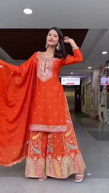 Designer Orange Georgette Embroidered Sharara Suit Set Featuring Intricate Mirror and Thread Work with Heavy Flared Sharara Bottom and Matching Embellished Dupatta – Ideal for Festive, Wedding, and Traditional Occasions