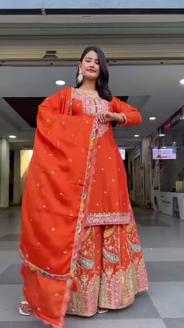 Designer Orange Georgette Embroidered Sharara Suit Set Featuring Intricate Mirror and Thread Work with Heavy Flared Sharara Bottom and Matching Embellished Dupatta – Ideal for Festive, Wedding, and Traditional Occasions