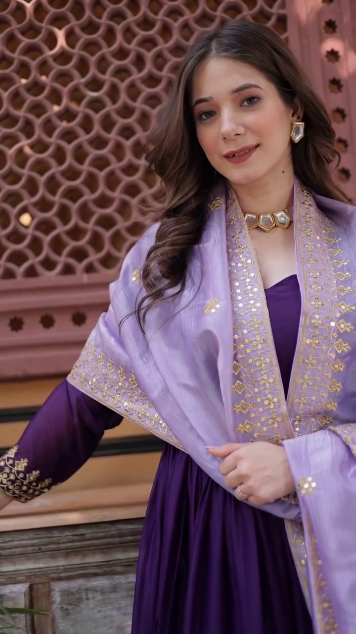 Regal Charm: Purple Anarkali with Lavish Gold Embroidery for a Timeless Festive Look