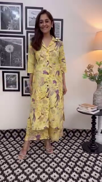 Yellow Floral Printed Two-Piece Co-Ord Set Featuring a Sleeveless Collared Top with Button Detailing and Matching Flared Palazzo Pants in Soft, Breathable Fabric – Perfect for Casual Chic Looks and Summer Outings