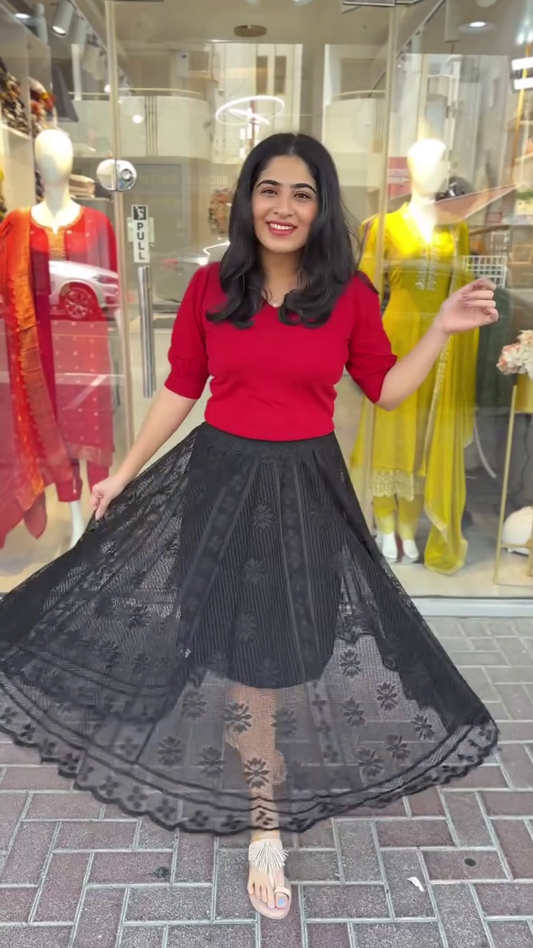 Trendy red knit top paired with a flared black embroidered mesh skirt – A playful and chic combo perfect for casual brunches or street-style statements.