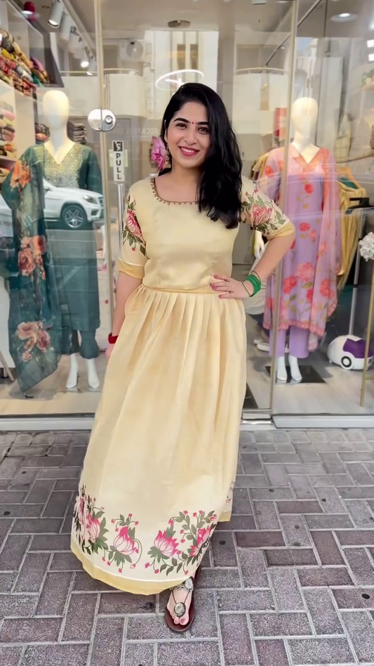 Yellow Gown Dress with Floral Embroidery on Sleeves and Hemline Graceful soft yellow gown-style dress featuring elegant floral embroidery on the sleeves and border – perfect for festive charm and traditional gatherings.