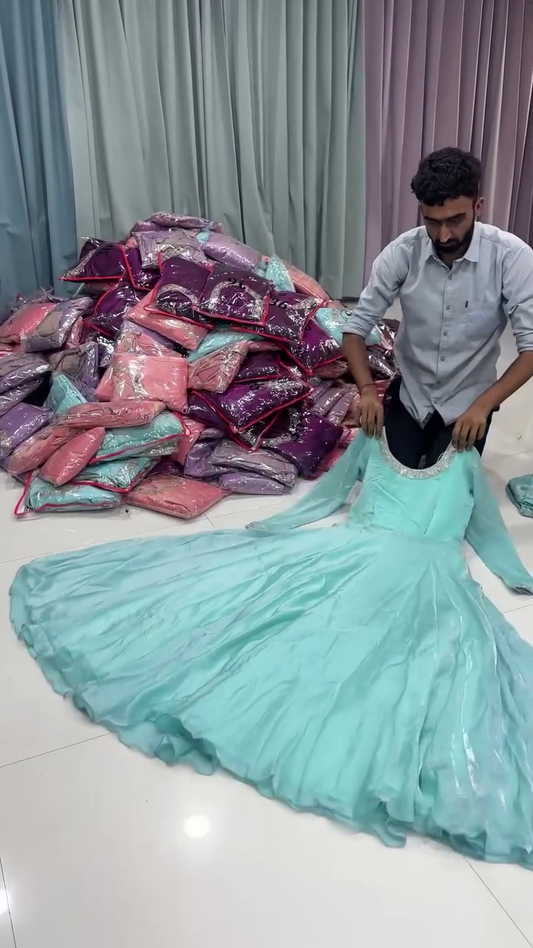 Aqua Blue Anarkali Dress with Intricate Embroidered Detailing and Flowing Skirt for Festive and Traditional Occasions