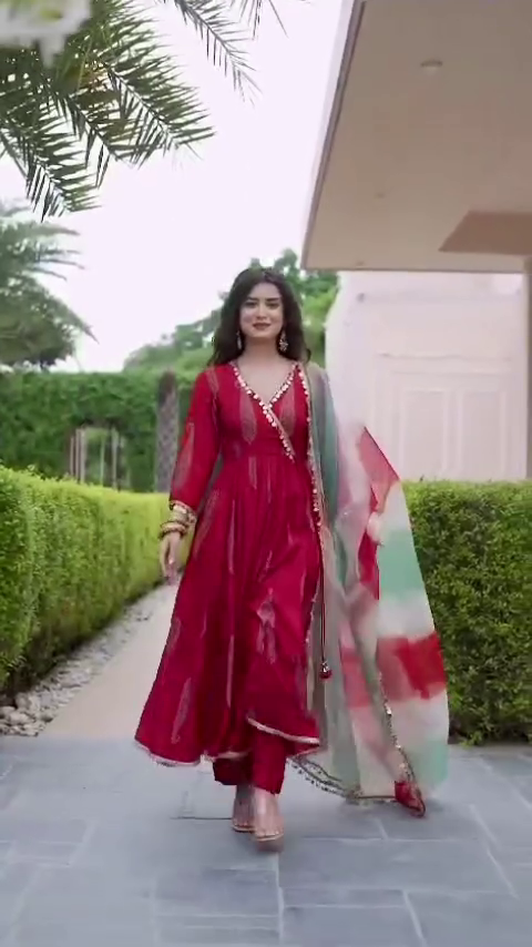 Red Anarkali Dress with Intricate Embroidery and a Flowy Silken Dupatta, Perfectly Complemented by Pearl Detailing, Ideal for Festive Celebrations and Special Occasions