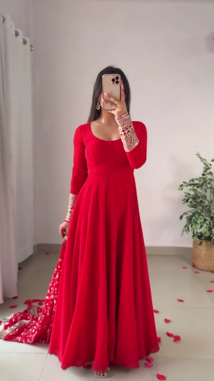 Elegant Red Anarkali Dress with Intricate Embellished Sleeves, Flowing Skirt, and Detailed Floral Dupatta for a Traditional yet Modern Look