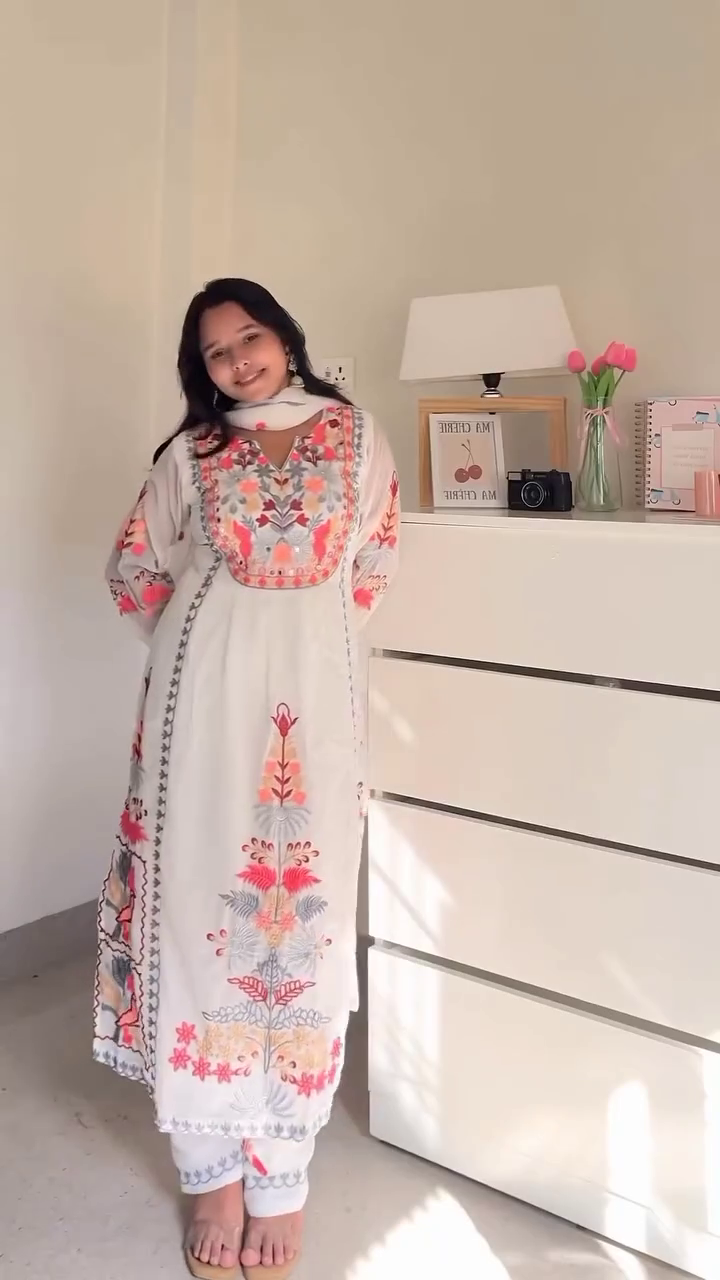 Elegant Ethnic Dresses Collection – Black Semi-Sheer Long Dress with Gold Accents & White Floral Embroidered Kurta with Dupatta for Traditional Occasions