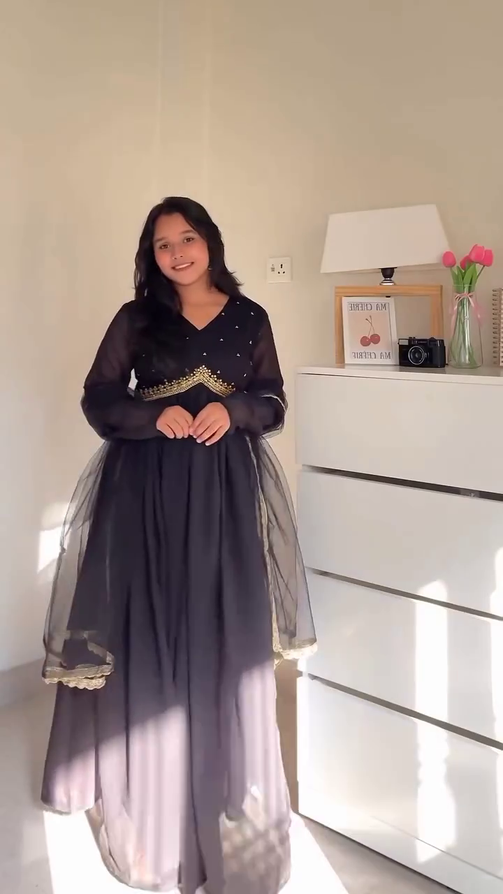 Elegant Ethnic Dresses Collection – Black Semi-Sheer Long Dress with Gold Accents & White Floral Embroidered Kurta with Dupatta for Traditional Occasions