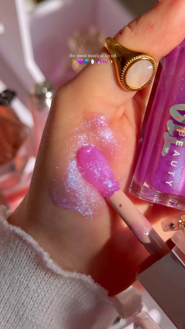The Most Magical Lip Oil with a Beautiful Purple Hue and Sparkling Finish, Perfect for Adding a Glossy, Hydrated Shine to Your Lips