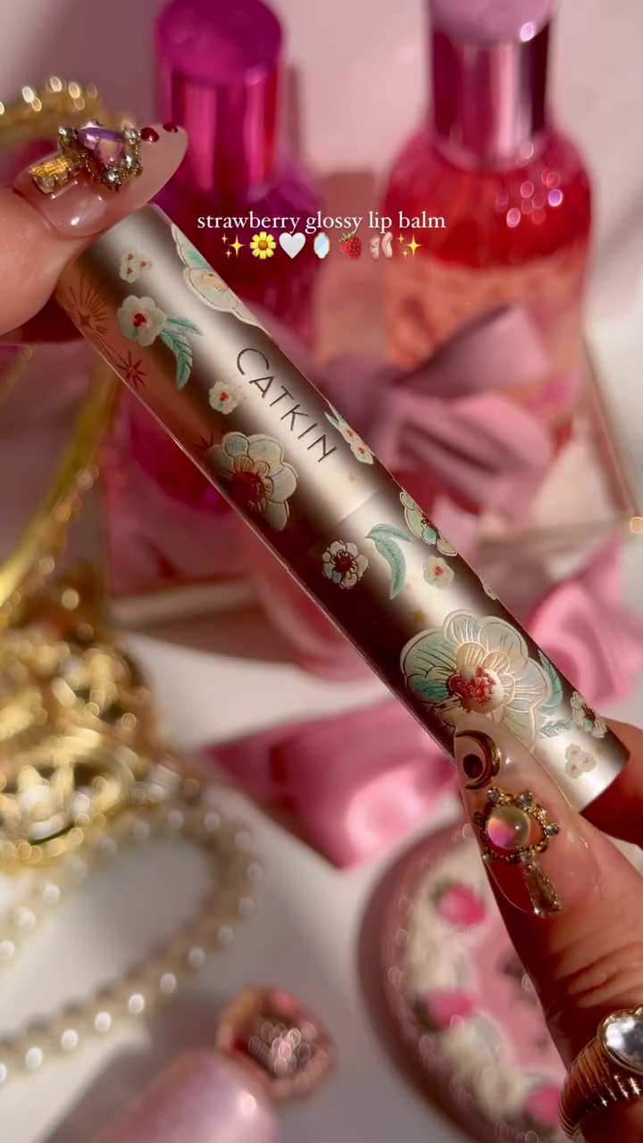 Strawberry Glossy Lip Balm with a Beautiful Floral Design, Offering a Hydrating and Glossy Finish for Soft, Smooth Lips with a Touch of Sweet Strawberry Scent