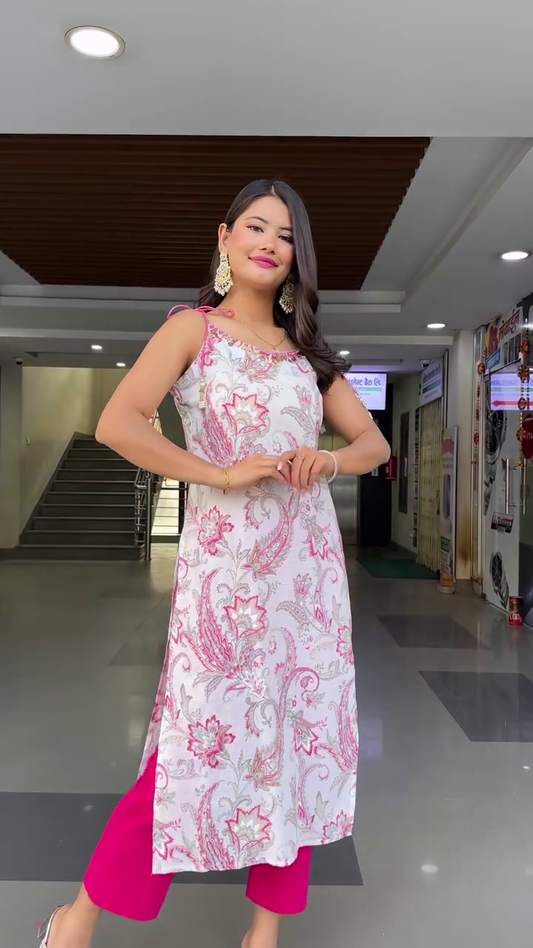 White and Pink Floral Printed Straight Kurti with Shoulder Tie-Up Detailing, Paired with Bright Pink Palazzo Pants – Sleeveless Ethnic Wear Set for Festive and Casual Occasions
