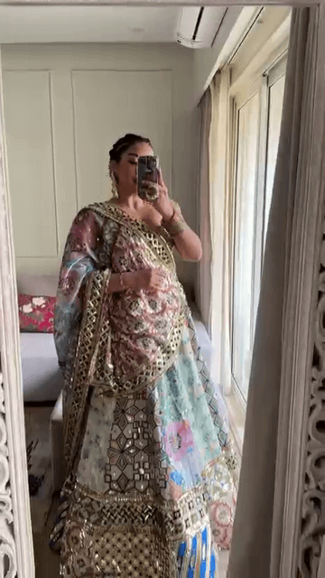 Opulent Multi-Colored Mirror Work Lehenga Set with Intricate Foil Detailing, Pastel Floral Prints, and Heavy Embroidered Dupatta – A Grand Statement for Weddings & Sangeet Nights