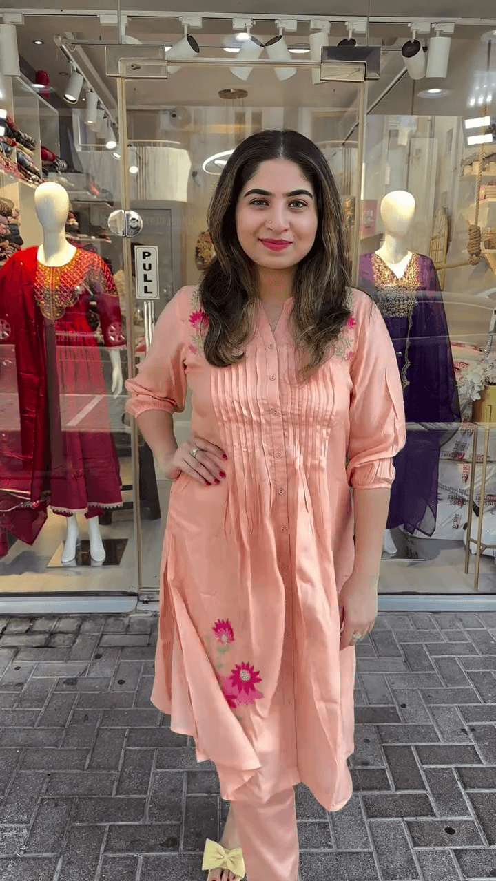Charming Peach Embroidered Kurti with Floral Detailing and Pleated Design for a Fresh, Elegant Look