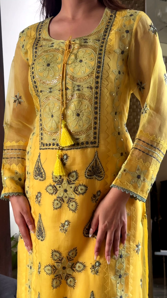 Yellow Embroidered Kurti with Intricate Threadwork and Tassel Detailing, Perfect for Festive and Casual Occasions